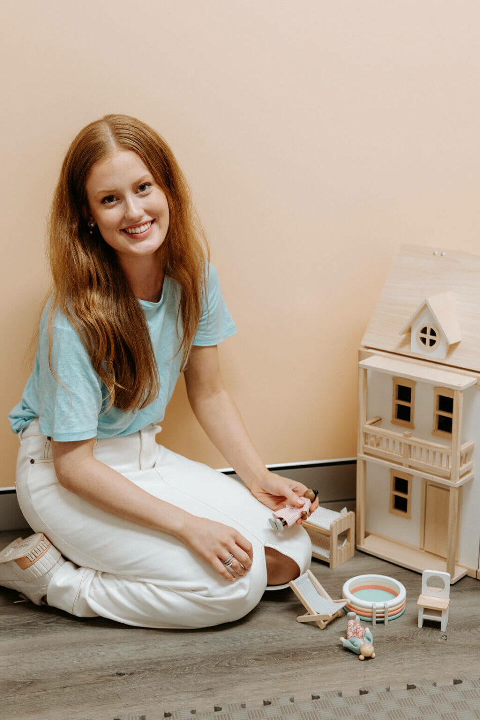 Lara Krueger with dolls house