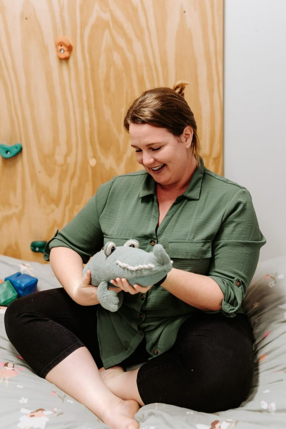 Tammy playing with toy crocodile