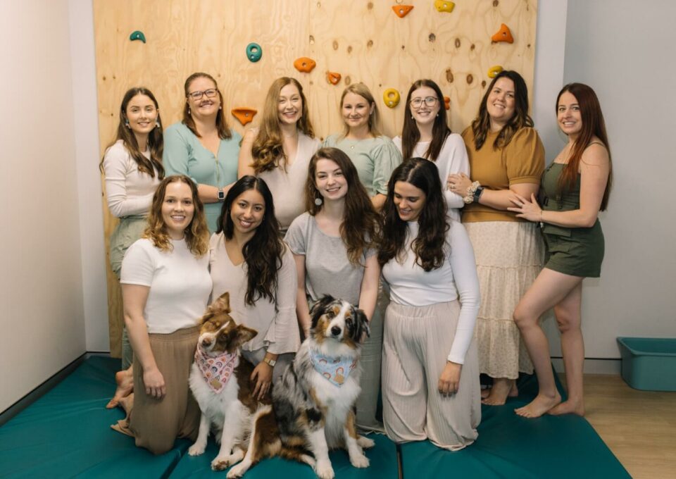 Inside Out Team in front of rock wall